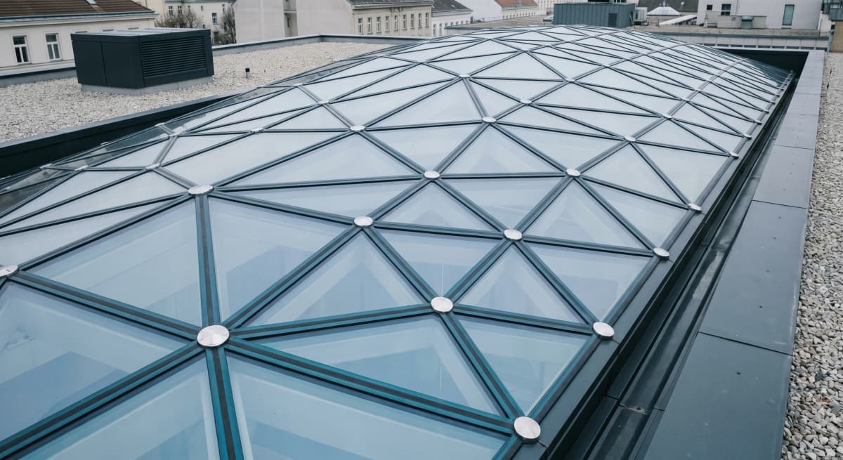 Parametric glass roof, fifth facade diagrid, oblique exterior view from adjacent rooftop