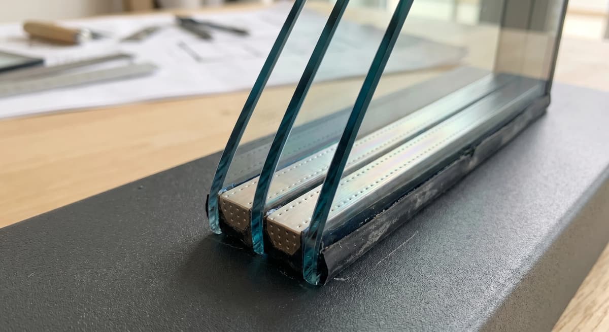 Laminated glass edge, iridescent Low-E teal coating, 3-layer lamination