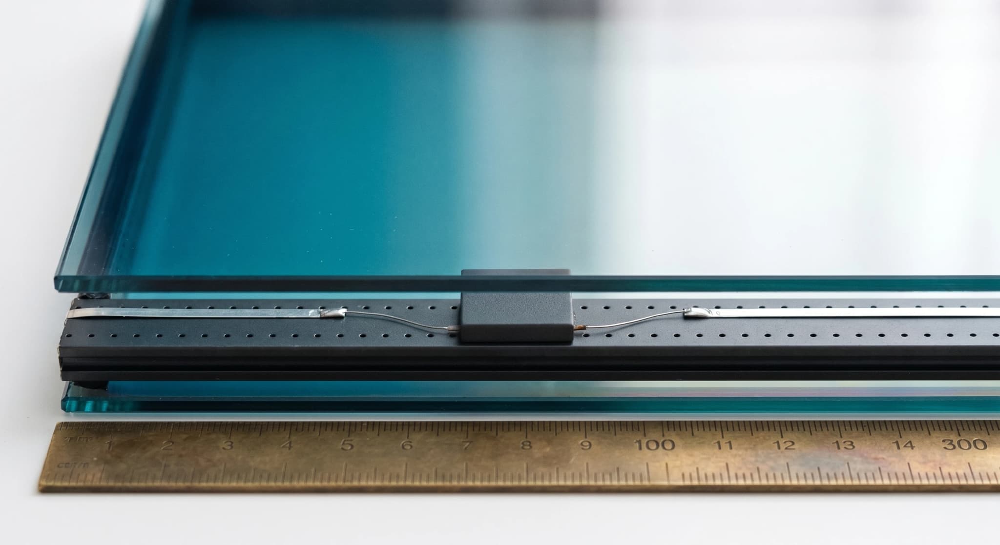 Electrochromic cell, laminated edge with silver busbars and sensor
