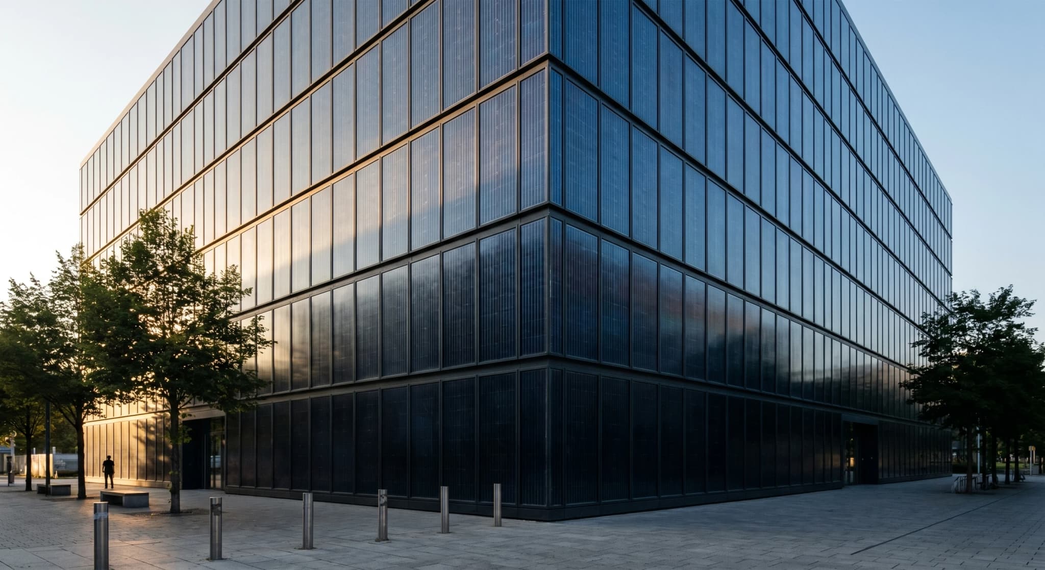 BIPV midnight-blue facade, contemporary building with photovoltaic panels